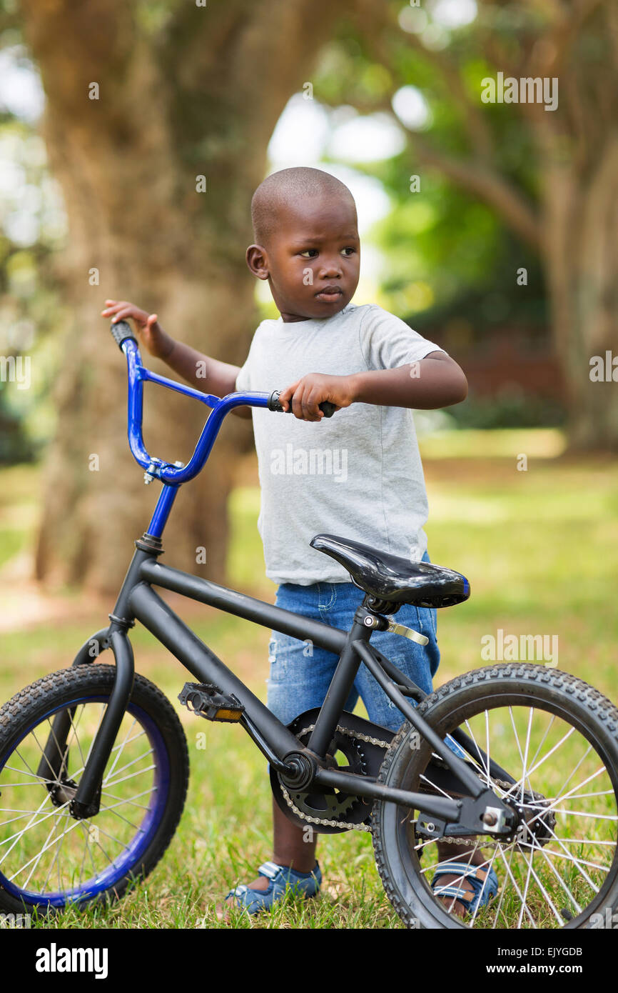cute-little-african-boy-with-his-bike-at-the-park-EJYGDB.jpg